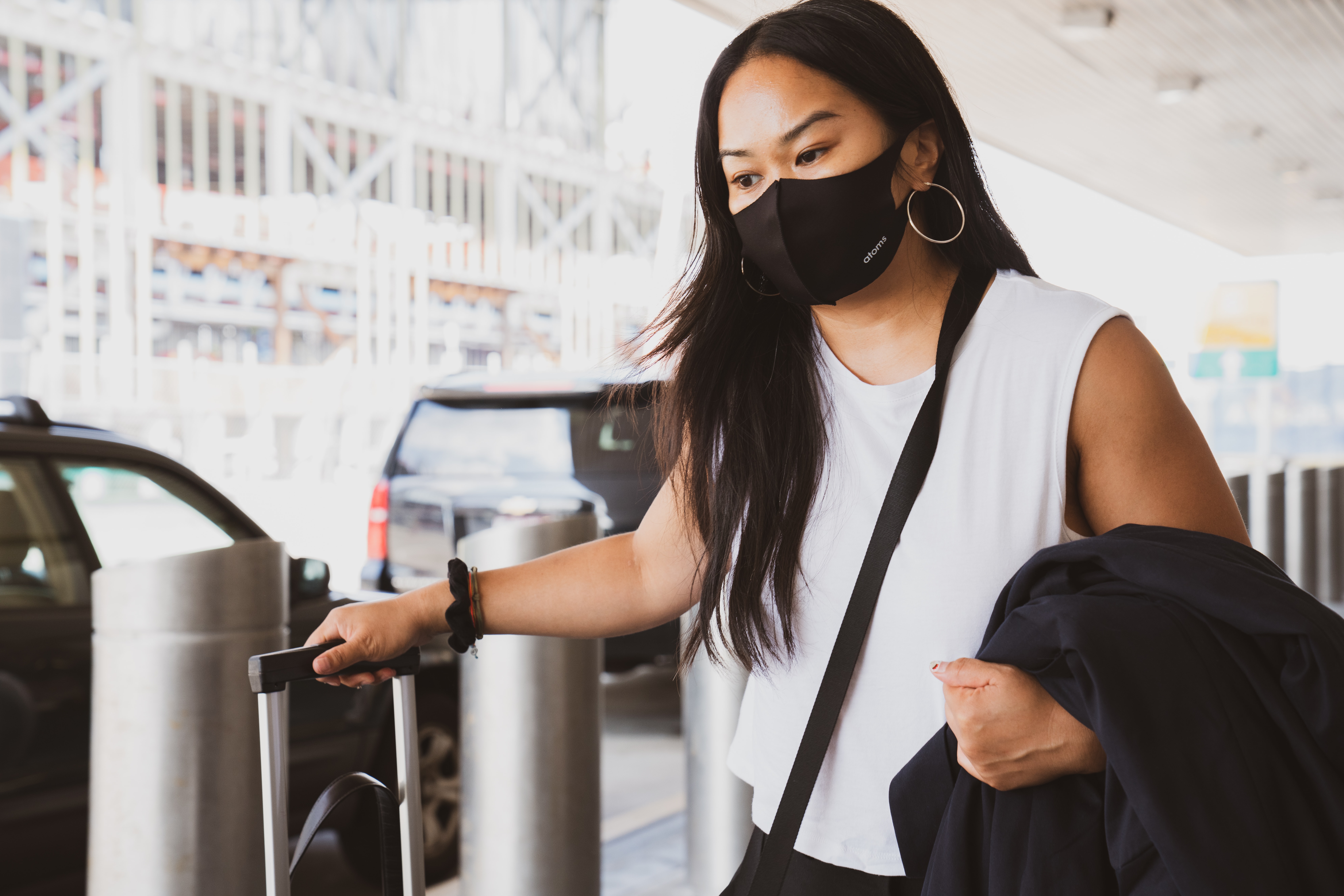 female traveler wearing a face mask